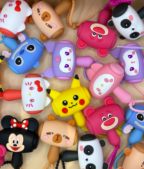 Collection of cute character keychains including Pikachu, Stitch, Hello Kitty and more